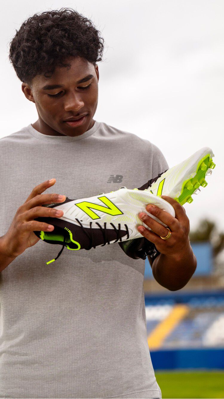 Endrick holding a pair of tekela