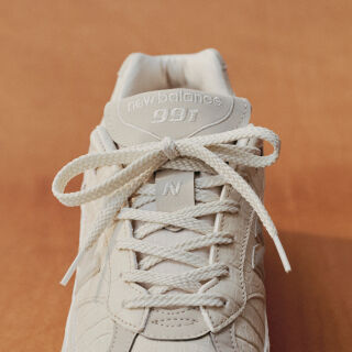 Close up view of a New Balance Made in UK sneaker tongue and laces.  