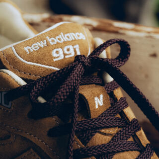 Close up view of a New Balance Made in UK sneaker tongue and laces.  